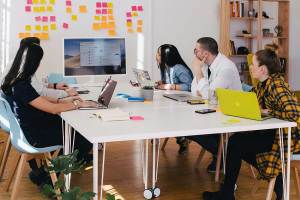 A group of teammates reviewing existing content as part of a website redesign evaluation