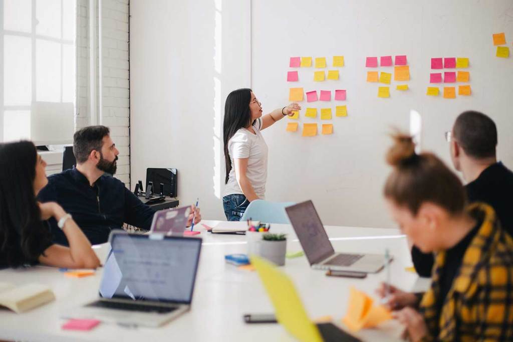 Coworkers reviewing technical performance as part of a website redesign analysis